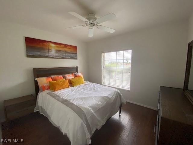 bedroom featuring ceiling fan and dark wood-type flooring