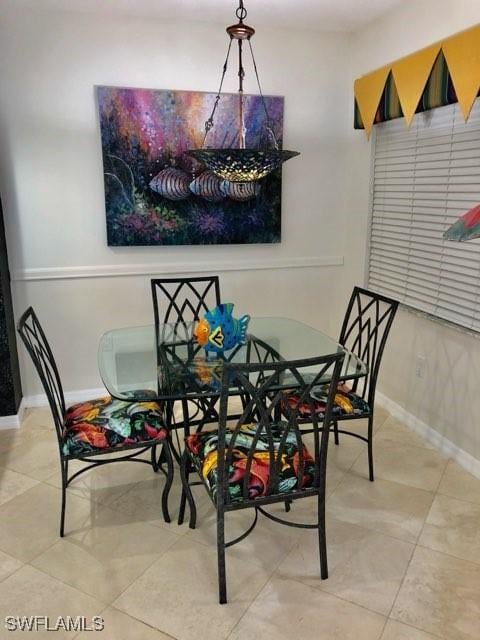 dining space featuring light tile patterned floors