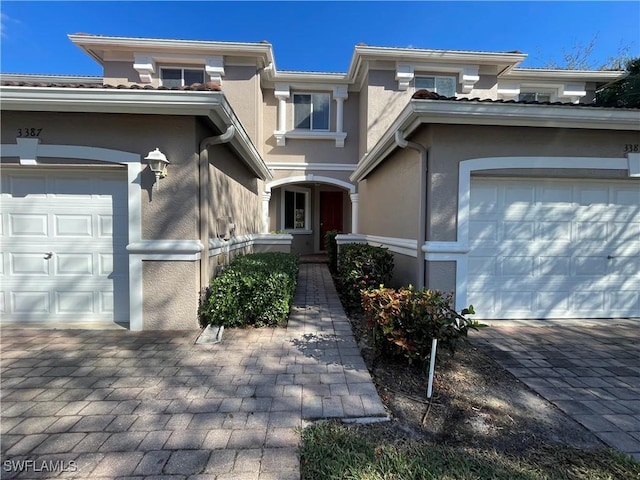 view of exterior entry with a garage