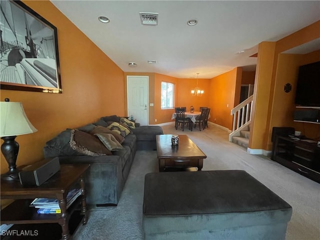 living room featuring carpet and a notable chandelier