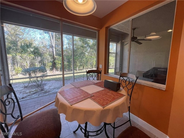 sunroom / solarium with ceiling fan