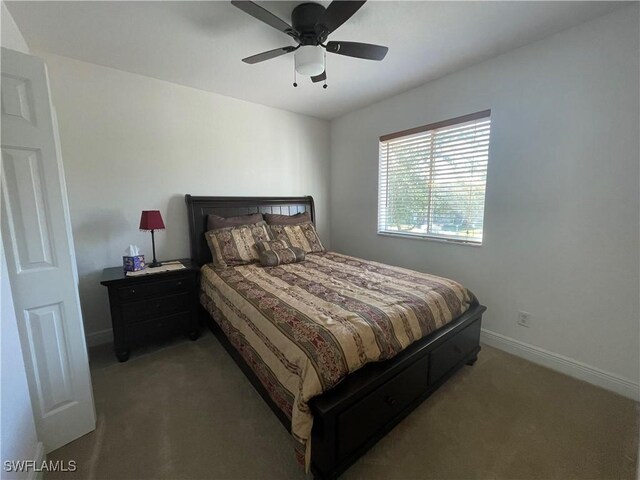 bedroom with baseboards, carpet, and a ceiling fan