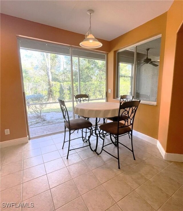 dining room featuring light tile patterned flooring and ceiling fan