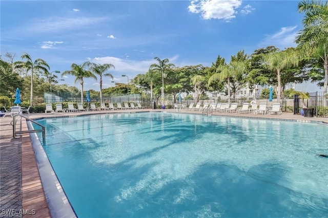 pool featuring a patio area and fence
