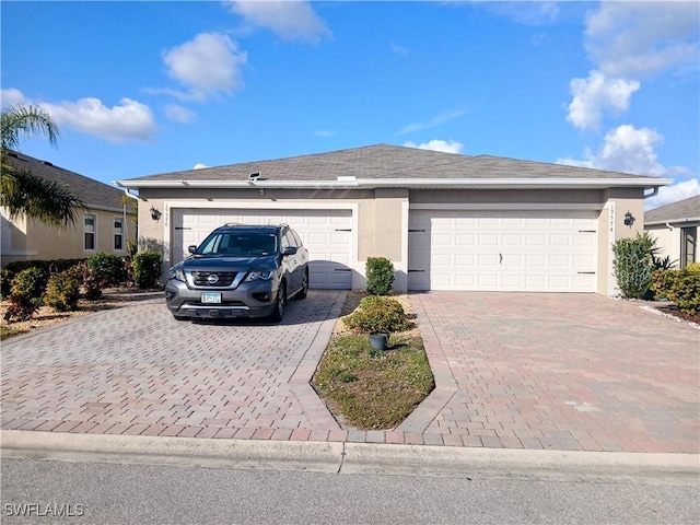 ranch-style home featuring a garage