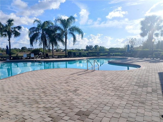 view of swimming pool with a patio