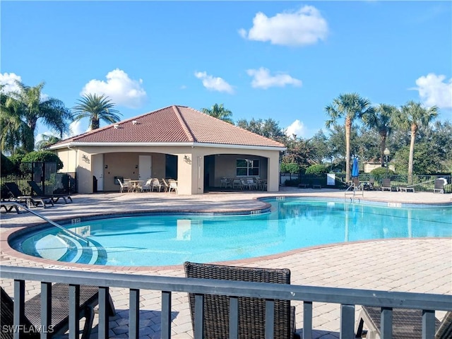 view of swimming pool featuring a patio area