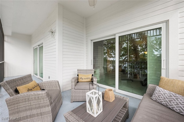 balcony with ceiling fan and a patio area