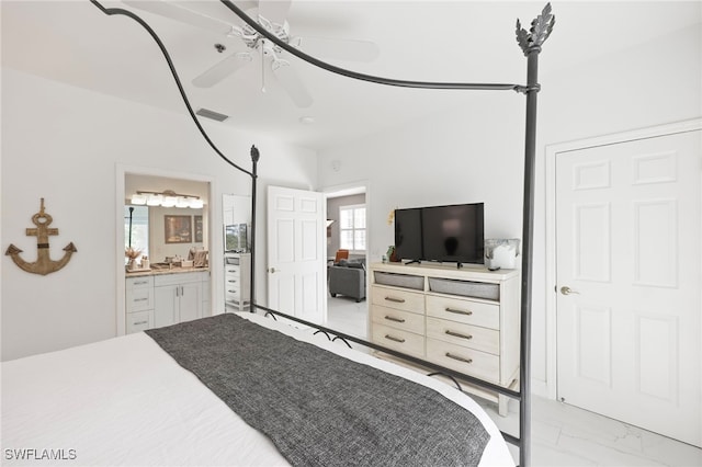 bedroom featuring ceiling fan and ensuite bathroom