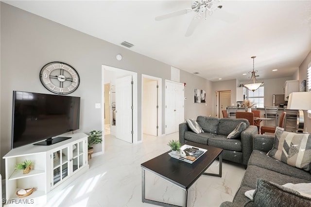 living room featuring ceiling fan