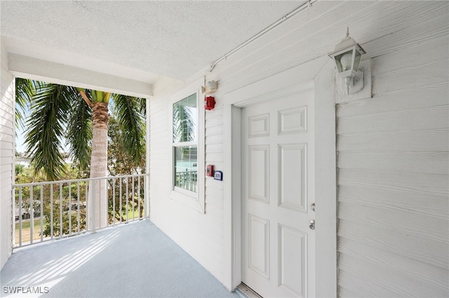 property entrance featuring covered porch