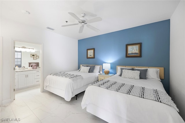 bedroom featuring connected bathroom and ceiling fan