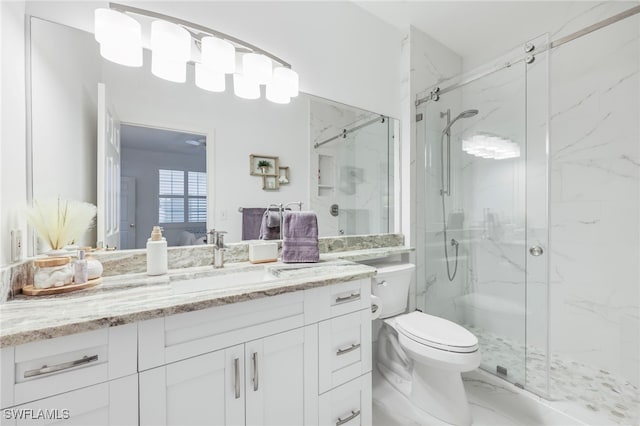 bathroom with vanity, toilet, and walk in shower