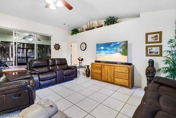 living room featuring light tile patterned flooring and vaulted ceiling