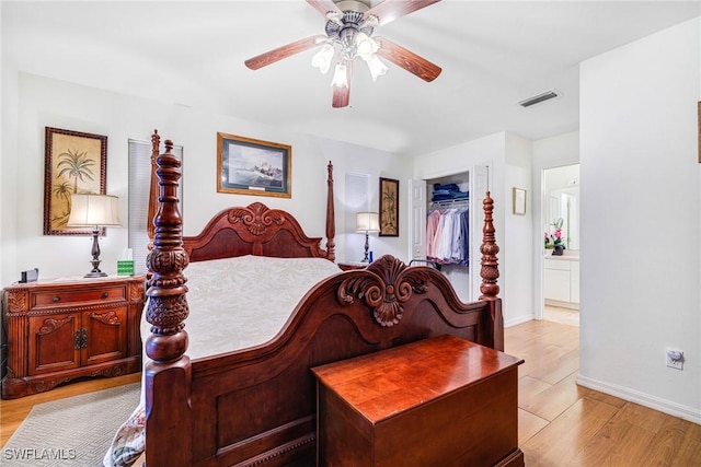 bedroom featuring ceiling fan, a closet, and light hardwood / wood-style floors