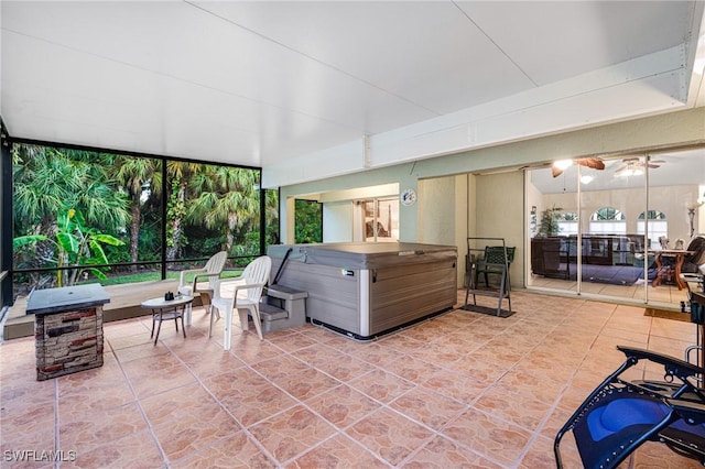 sunroom featuring ceiling fan