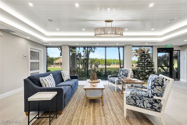 living room featuring a tray ceiling