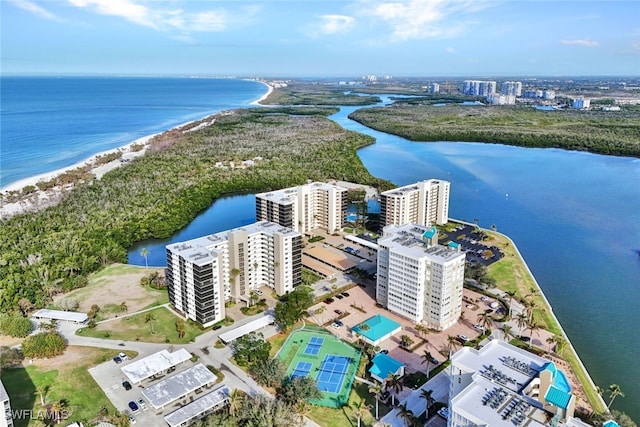 drone / aerial view featuring a water view and a view of the beach