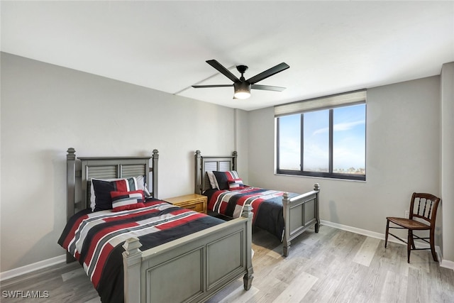 bedroom featuring ceiling fan and light hardwood / wood-style flooring