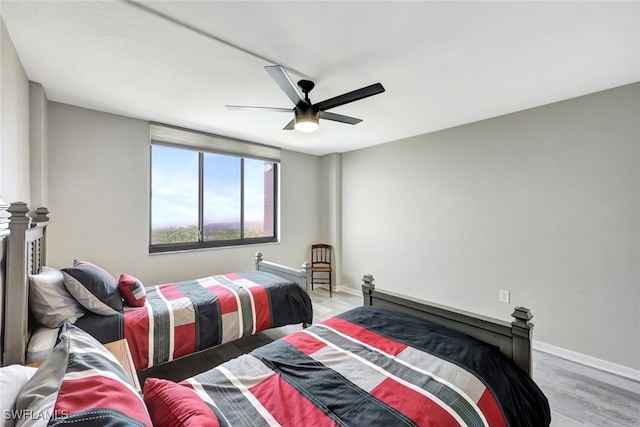 bedroom featuring ceiling fan and light hardwood / wood-style floors