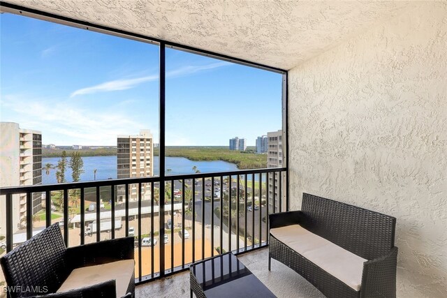 sunroom with a water view