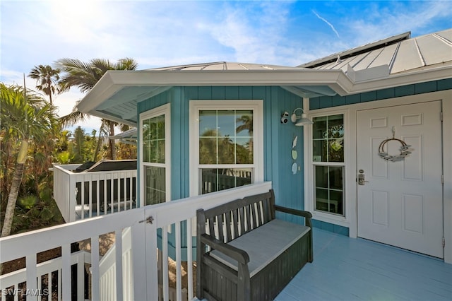 property entrance featuring a wooden deck