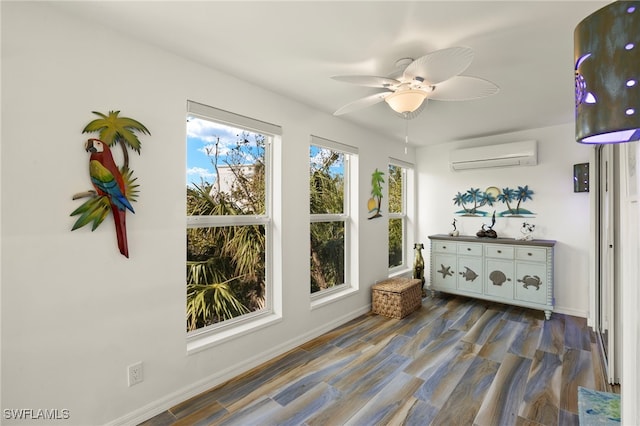 sunroom with ceiling fan and a wall unit AC