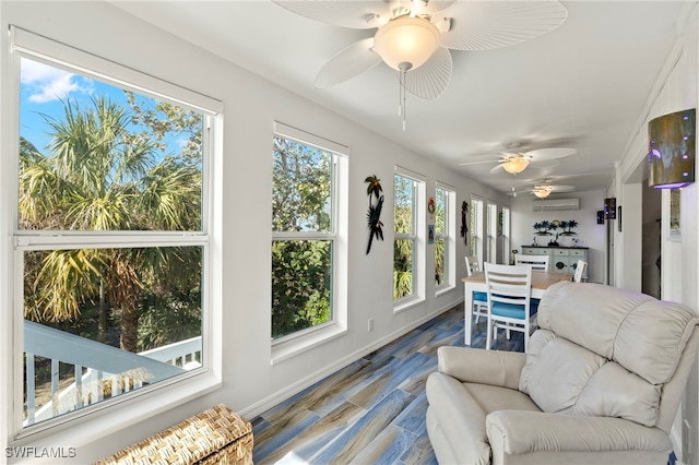 sunroom / solarium featuring plenty of natural light and an AC wall unit