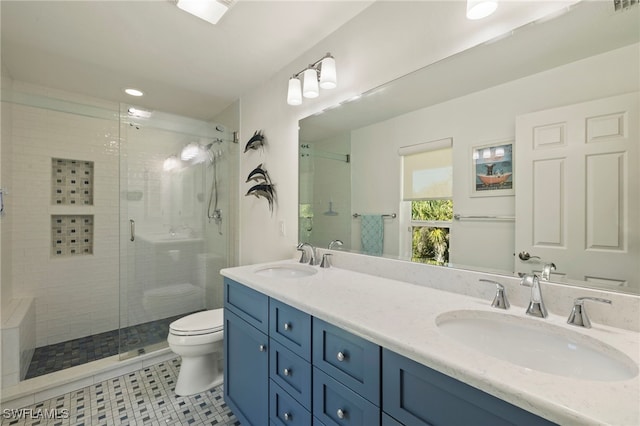 bathroom featuring walk in shower, vanity, and toilet