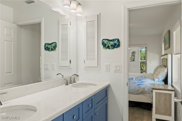 bathroom featuring vanity and hardwood / wood-style flooring