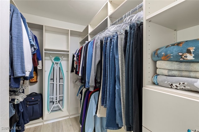 spacious closet featuring light wood-type flooring