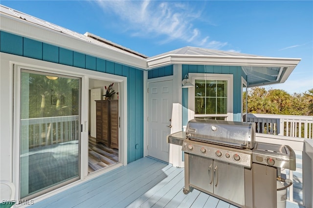 wooden terrace with area for grilling