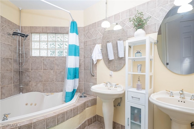 bathroom featuring shower / bath combination with curtain and sink