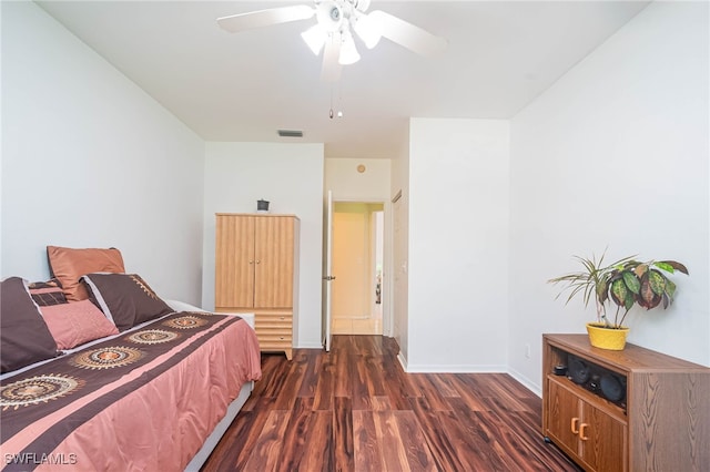 bedroom featuring ceiling fan and dark hardwood / wood-style flooring