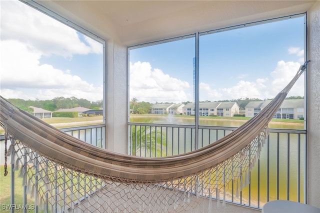 sunroom with a water view