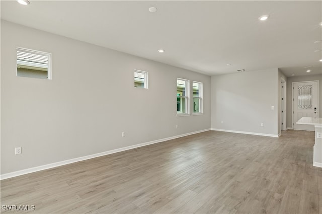 empty room with light wood-type flooring