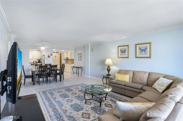 tiled living room featuring ceiling fan and ornamental molding