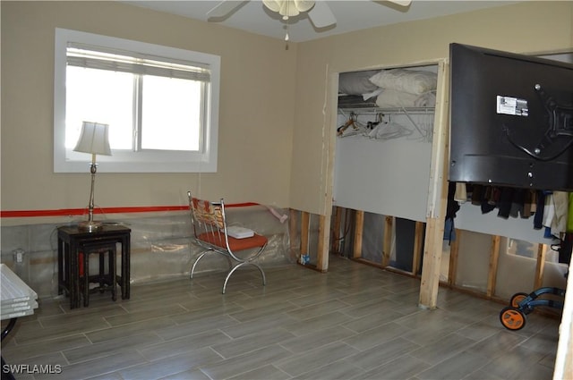 misc room with light wood-type flooring and ceiling fan