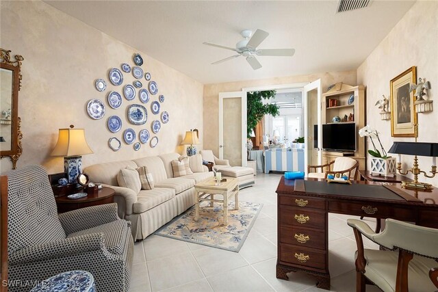 living room with ceiling fan and light tile patterned floors