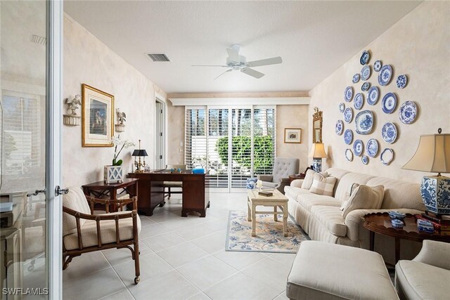 living room featuring ceiling fan, light tile patterned floors, and french doors