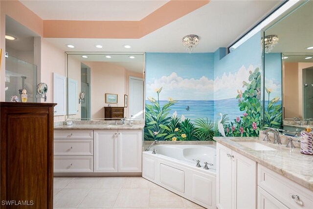 bathroom featuring shower with separate bathtub, vanity, and tile patterned floors