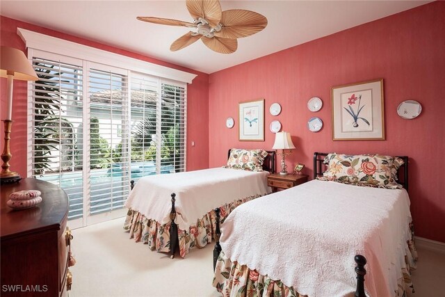 carpeted bedroom featuring ceiling fan and access to outside