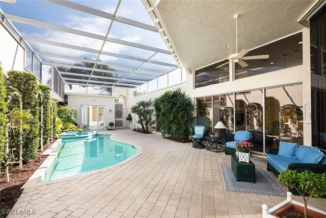 view of pool with an outdoor hangout area, ceiling fan, and a patio area