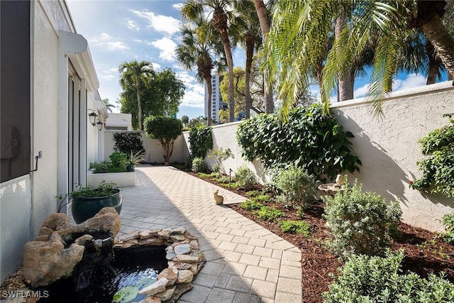 view of yard featuring a patio area and a fenced backyard