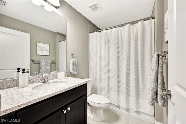 full bathroom featuring vanity, shower / bath combo, tile patterned flooring, toilet, and a textured ceiling