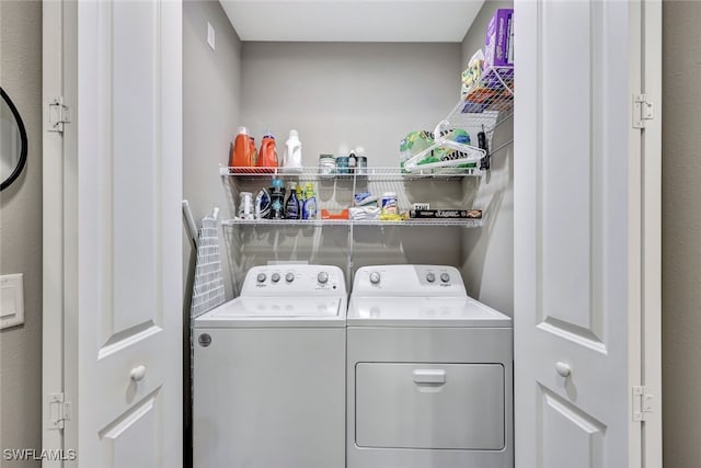 laundry room with separate washer and dryer