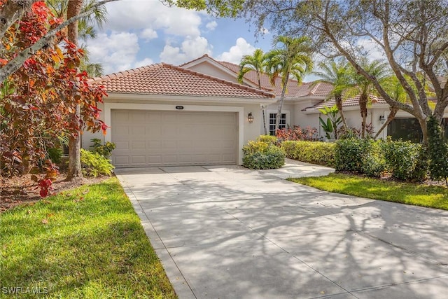 mediterranean / spanish-style home with a garage