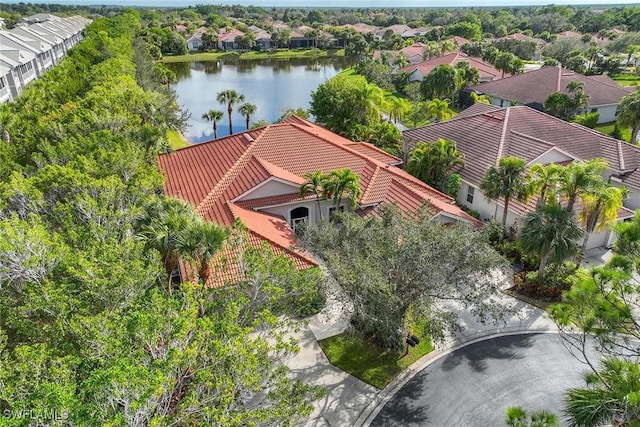 birds eye view of property with a water view