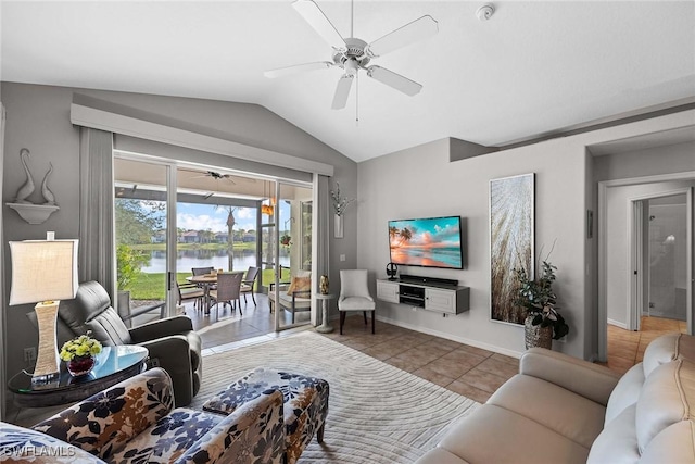 living room featuring ceiling fan, tile patterned flooring, and vaulted ceiling