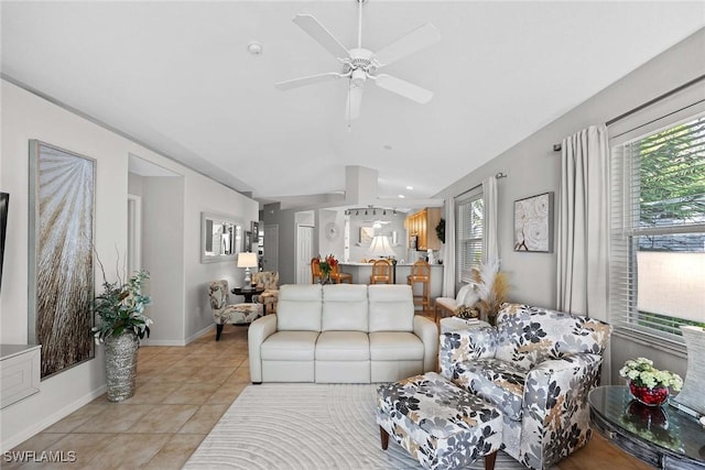 living room featuring ceiling fan and light tile patterned floors